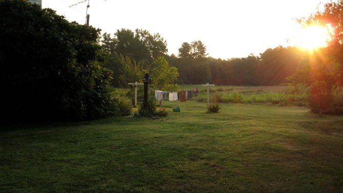 Image of a countryside with laundry hanging on a clothesline